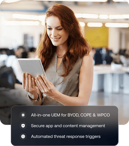 Professional woman smiling while using a tablet, overlaid with a list of features including BYOD, COPE, and WPCO of the Android device management solution by Hexnode.
