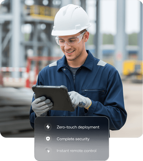 Image of a smiling worker in a hard hat and safety glasses using a tablet, representing Hexnode’s purpose built management and zero-touch deployment for rugged devices in field operations.