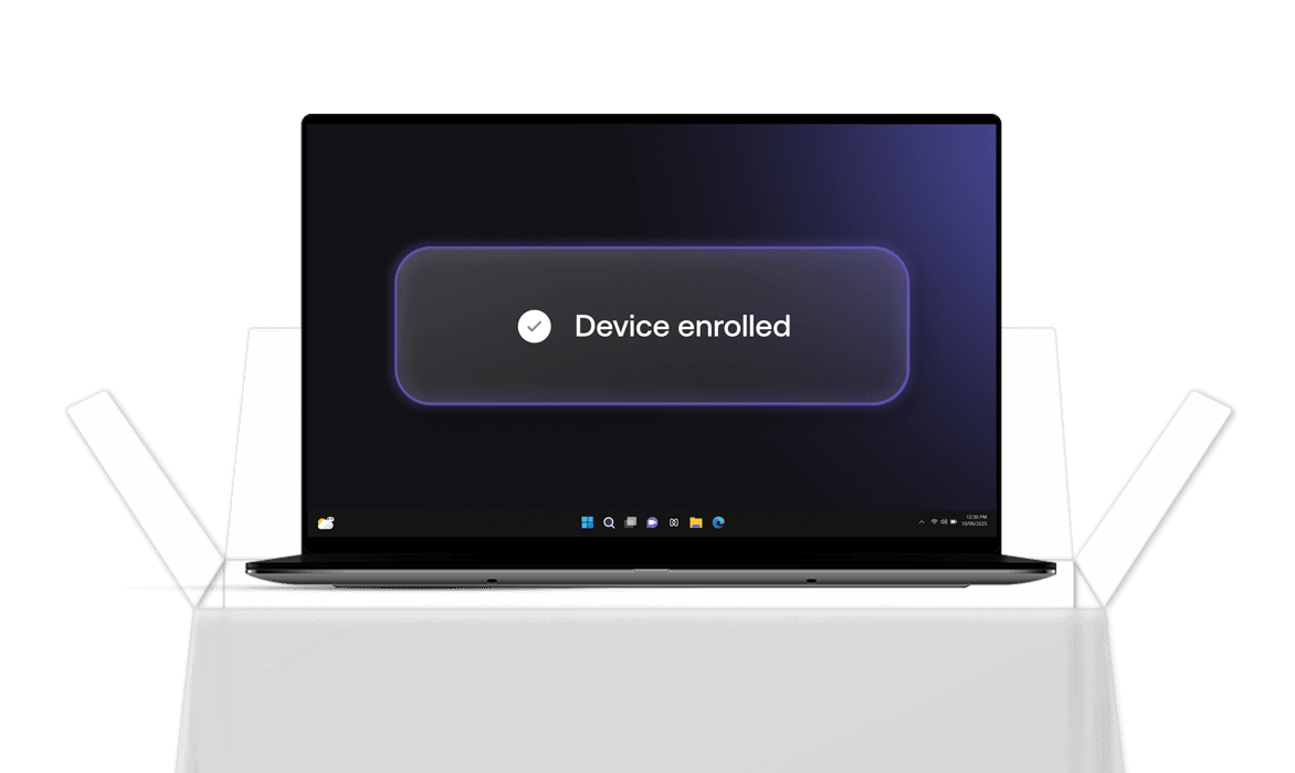 A Mac laptop screen showing a glowing “Device enrolled” confirmation banner, indicating successful macOS enrollment.